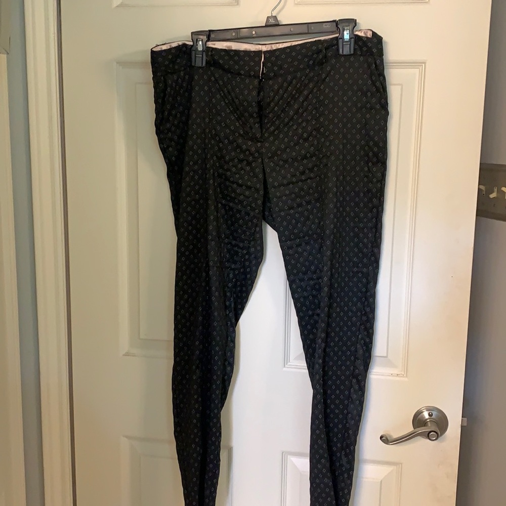 Black cropped dress pants with small white print.